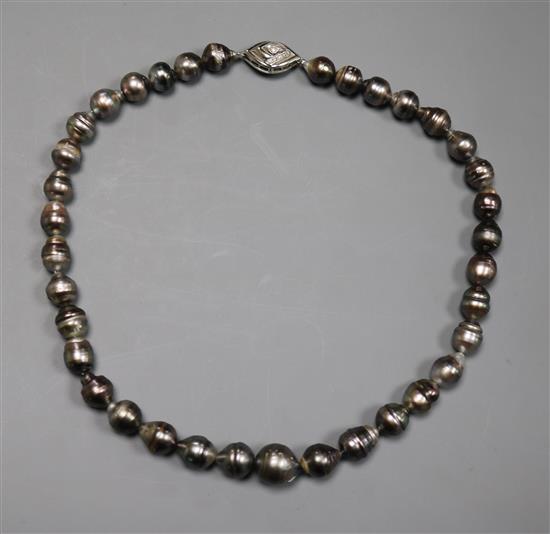 A modern single strand baroque cultured Tahitian? pearl choker necklace with a 14kt white gold and diamond set clasp, 40cm